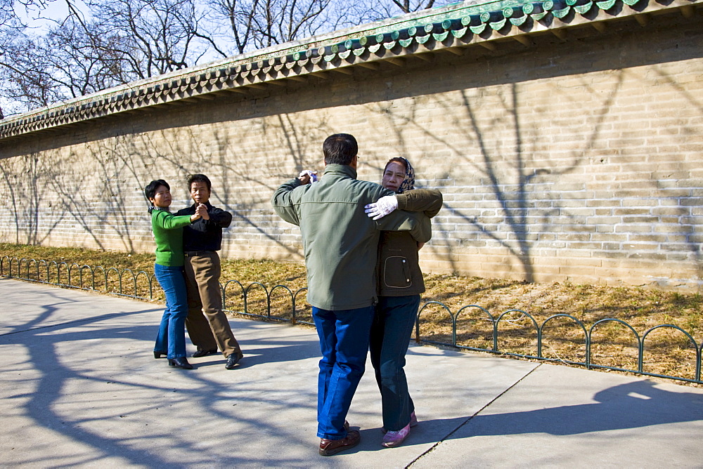 Couples dancing in park of the Temple of Heaven, Beijing, China