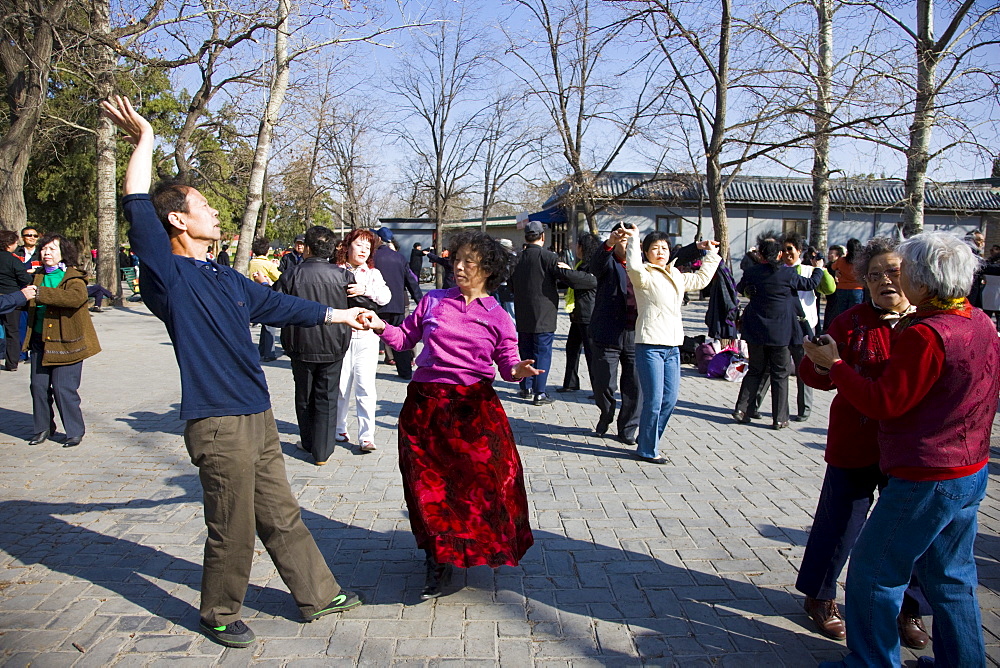 Couples dancing in park of the Temple of Heaven, Beijing, China