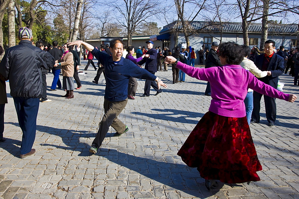 Couples dancing in park of the Temple of Heaven, Beijing, China