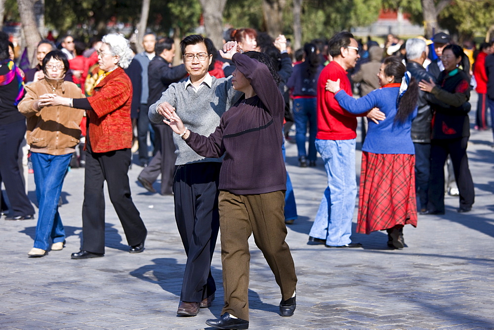 Couples dancing in park of the Temple of Heaven, Beijing, China