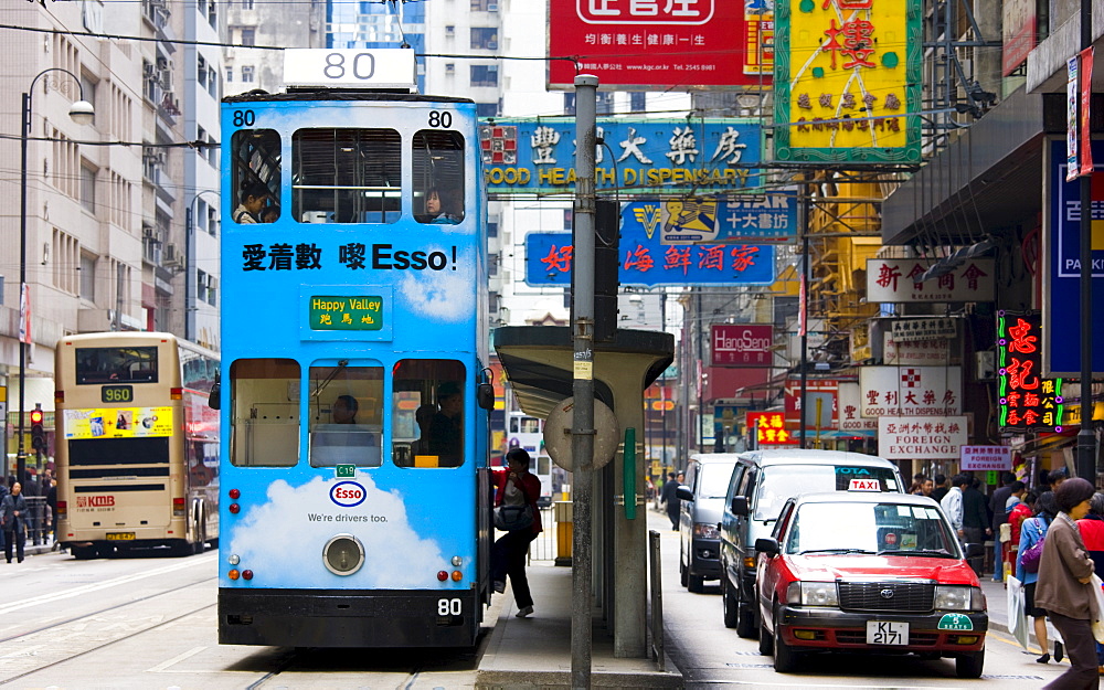 Tram in traditional old Chinese district, Des Voeux Road, Sheung Wan, Hong Kong Island, China