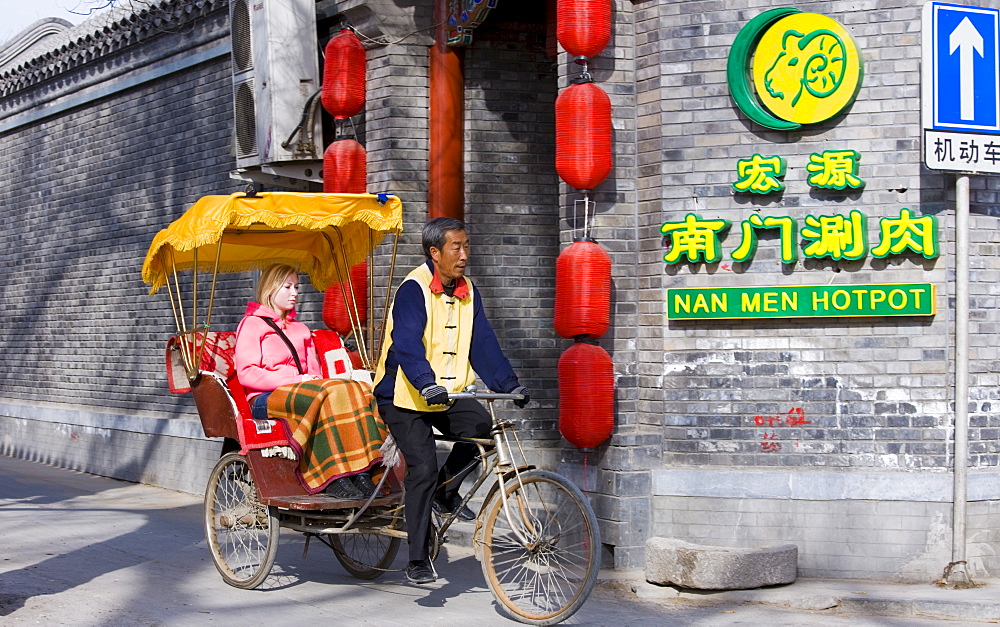 Western tourist in a rickshaw, Hutongs area, Beijing, China