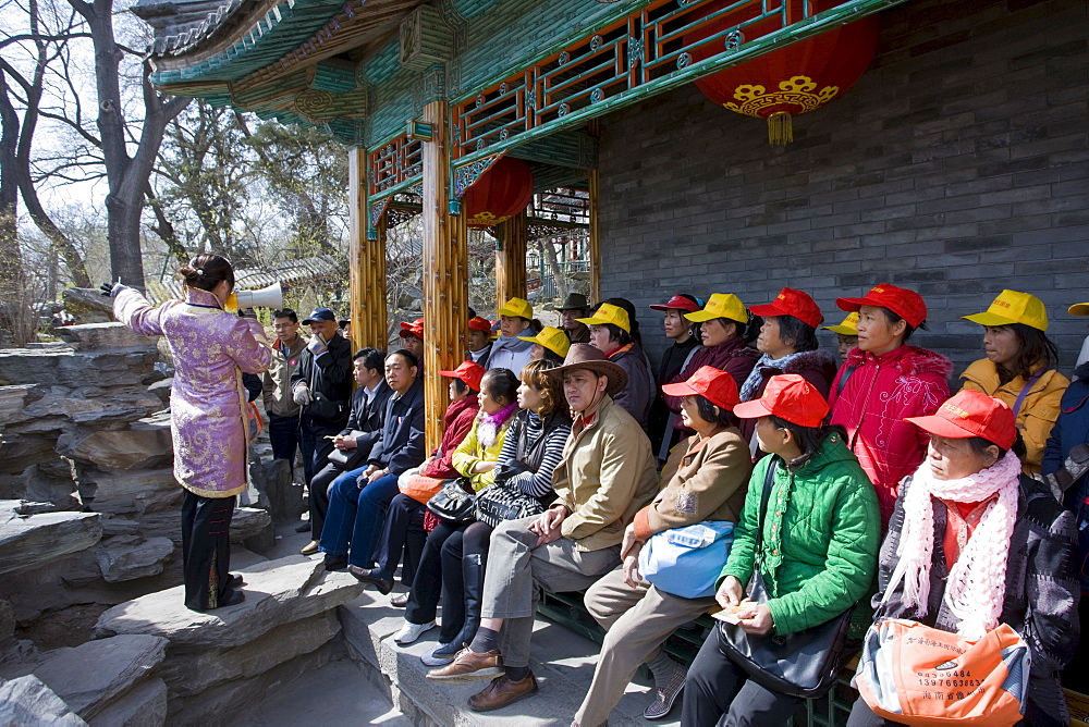 Tour guide with tourists at Prince Gong's Mansion, Hutongs Area, Beijing, China