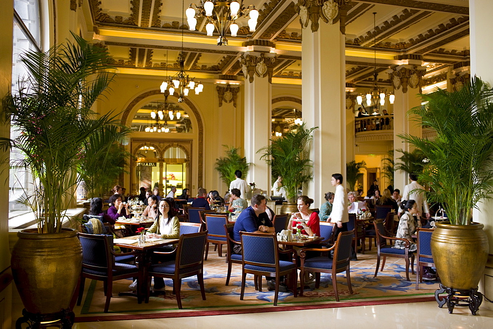 Guests enjoy high tea at the Peninsula Hotel, Hong Kong, China