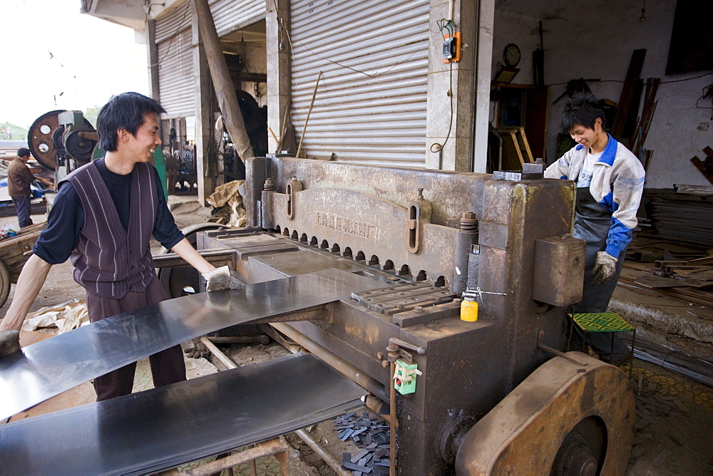 Men working at metal recycling steel in Dazu County, Chongqing, China