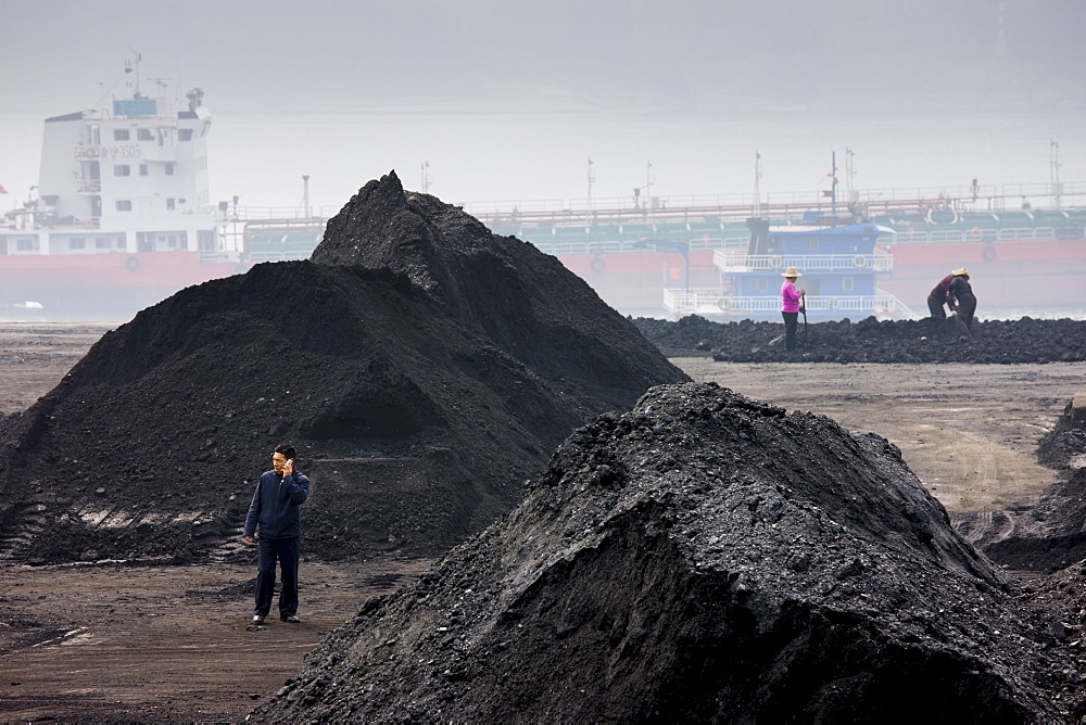 Coal in piles by Yangzi River, Yichang, China