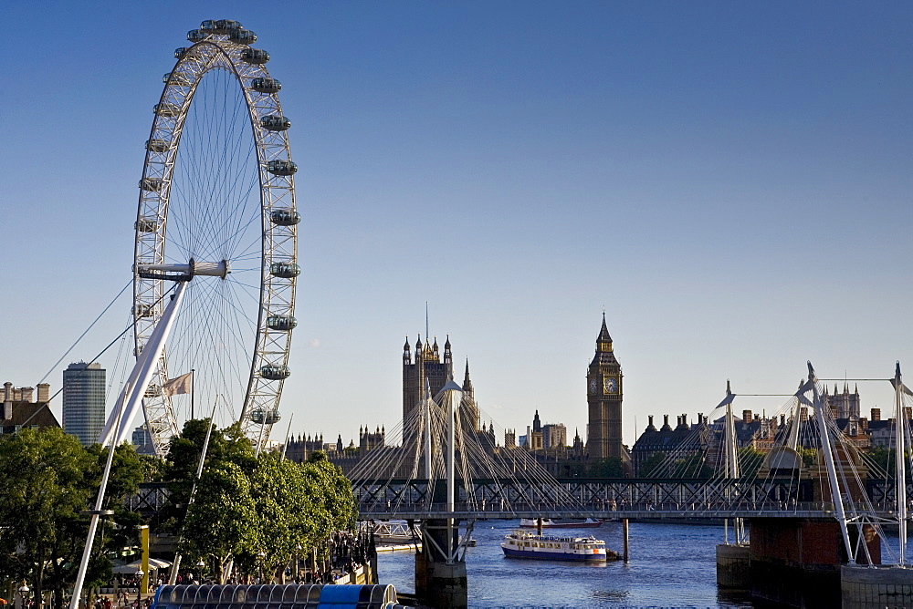 View of London from the Southbank shows London Eye, Big Ben, Houses of Parliament,  England, UK