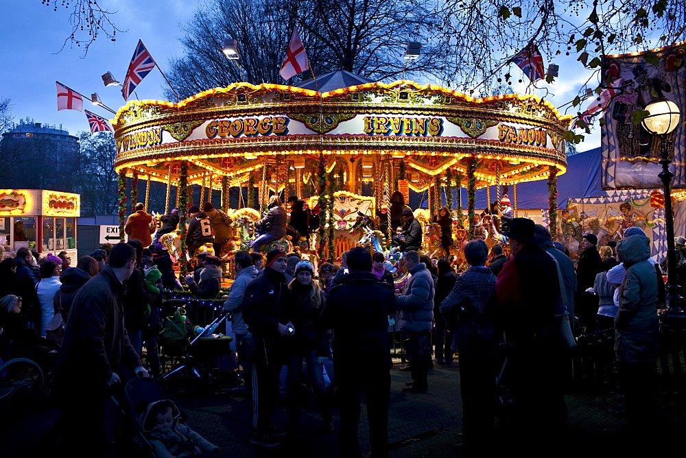 Merry-go-round carousel at Christmas fairground and market, Winter Wonderland, in Hyde Park, London