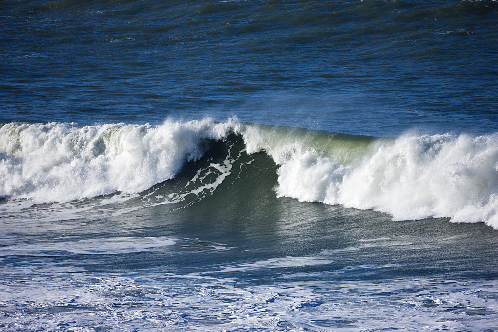 Rolling waves in the sea at Woolacombe, North Devon, UK