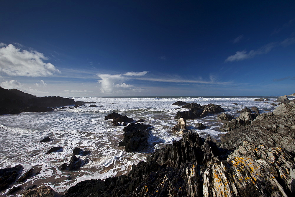 Waves lapping onto the beach at Watersmeet Bay near Woolacombe, North Devon, UK