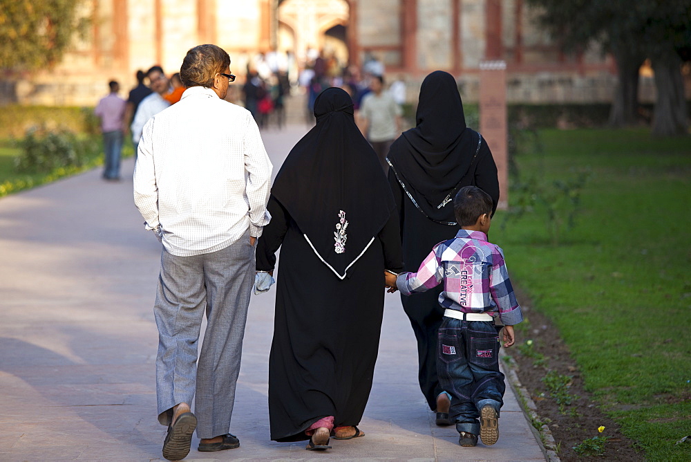 Muslim family visitors at Humayuns Tomb, World Heritage Monument built 16th Century, in New Delhi, India