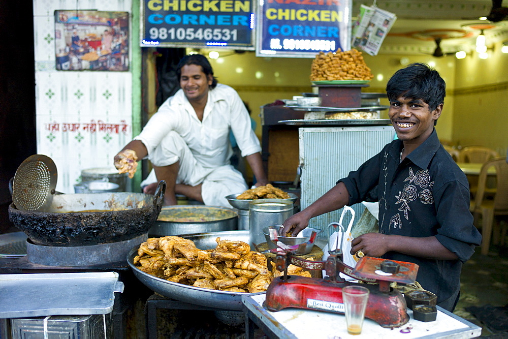 Food on sale at Chicken Corner in Snack market at muslim Meena Bazar, in Old Delhi, India