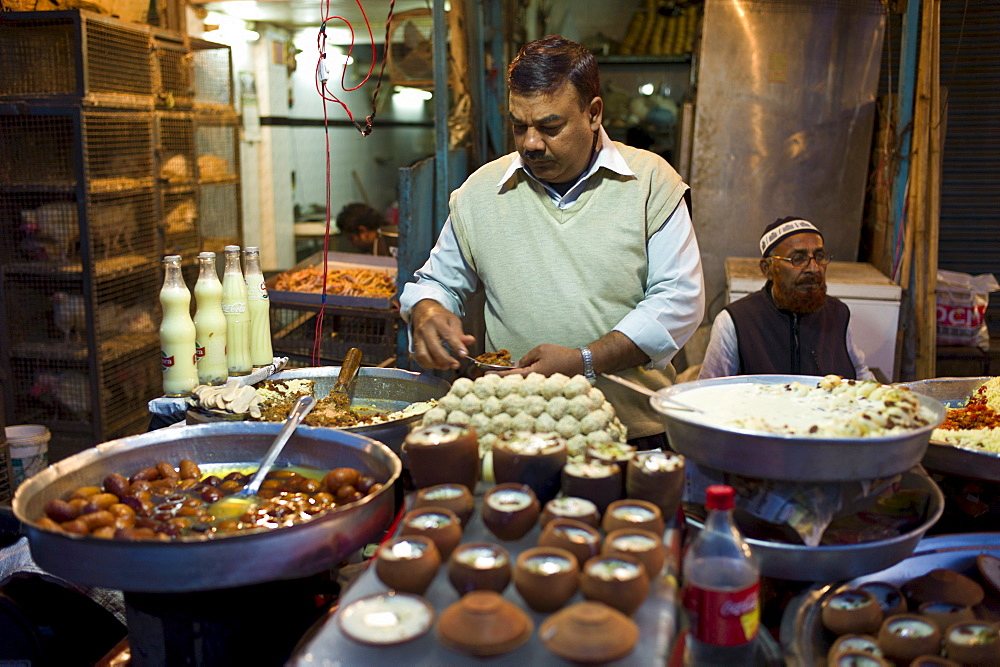 Food on sale at meat stall in Snack market at muslim Meena Bazar, in Old Delhi, India