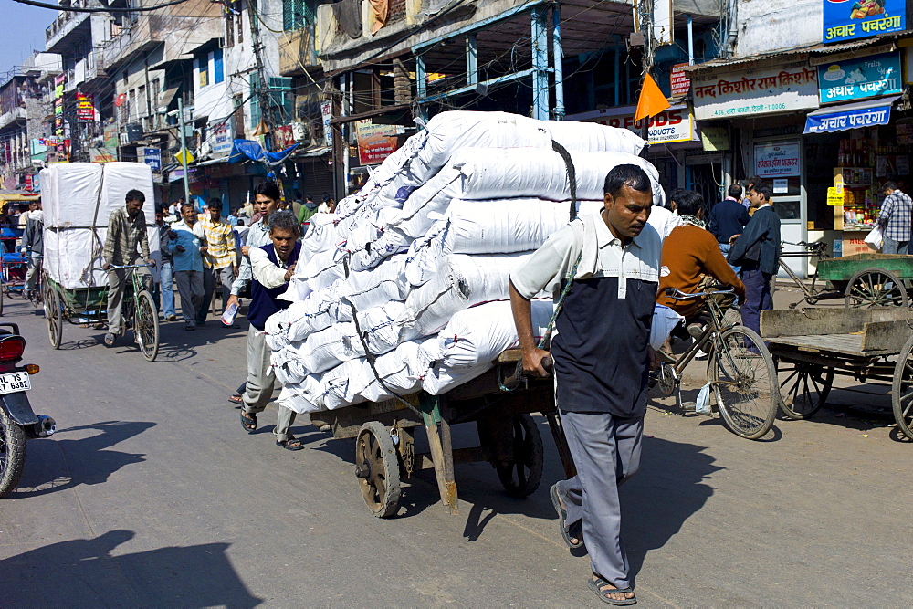 Porters at Khari Baoli spice and dried foods market, Old Delhi, India