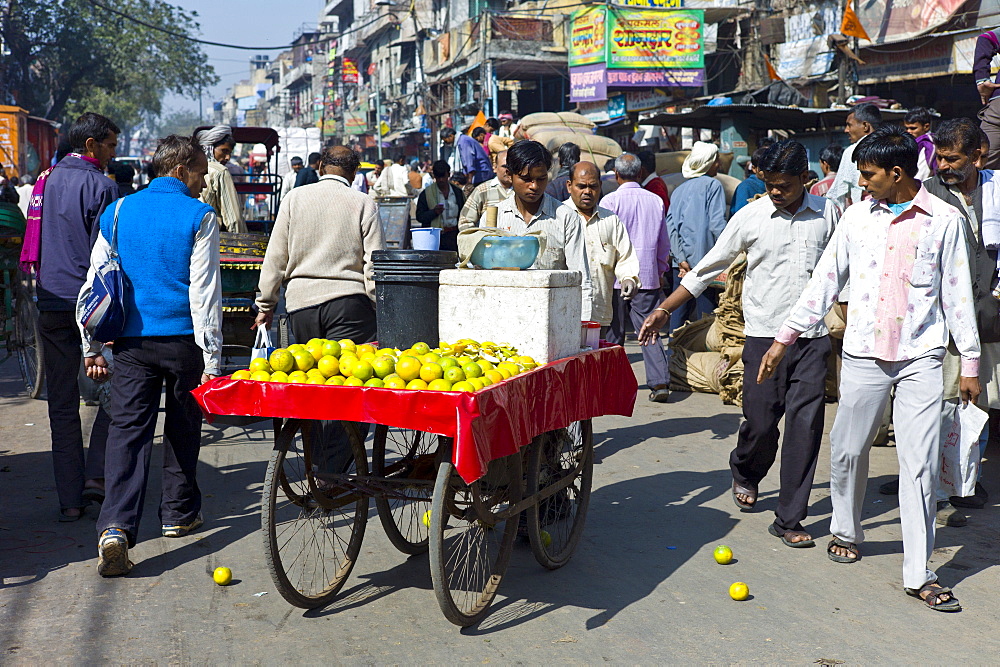 Oranges being sold from a cart at Khari Baoli in Old Delhi, India