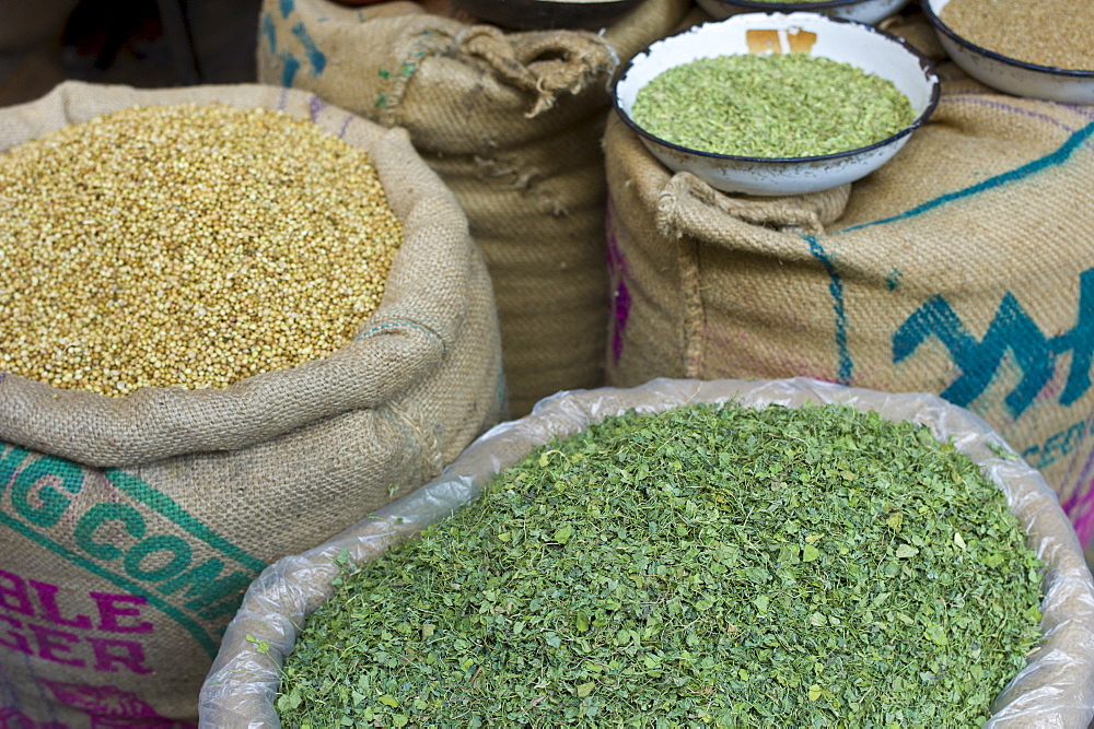 Coriander seeds and dried fenugreek leaves on sale at Khari Baoli spice and dried foods market, Old Delhi, India