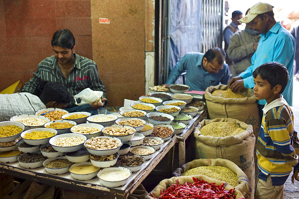 Red chillies, turmeric and other spices on sale at Khari Baoli spice and dried foods market, Old Delhi, India