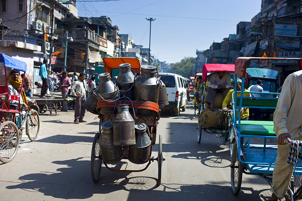 Milk churns on rickshaw at Khari Baoli food market, Old Delhi, India