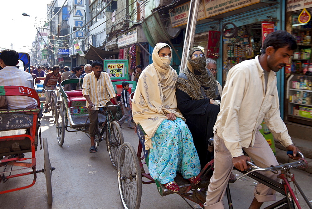 Muslim women in rickshaw in Old Delhi, India