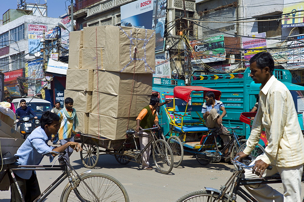 Crowded street scene at Chawri Bazar in Old Delhi, India