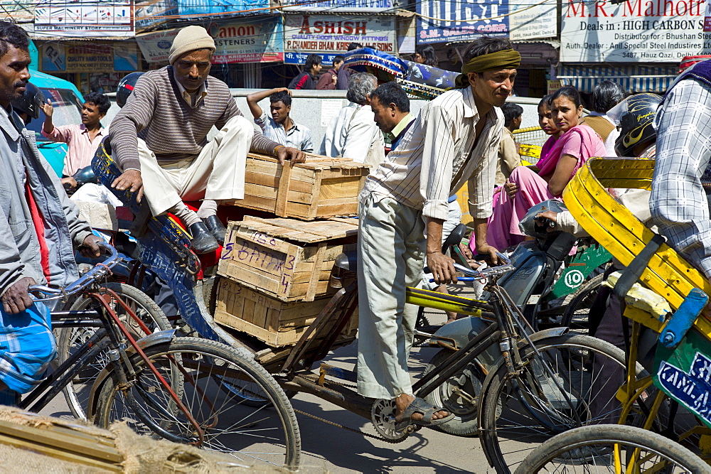 Crowded street scene at Chawri Bazar in Old Delhi, India