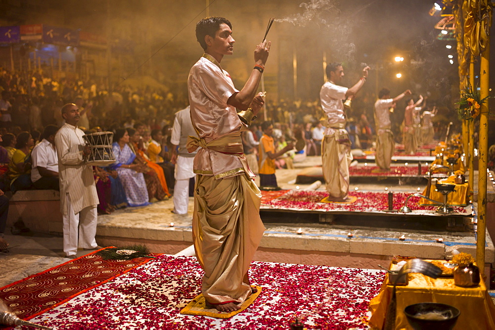 Hindu priests at sundown Aarti Ritual Ceremony of Light during Shivrati Festival in Holy City of Varanasi, Benares, India