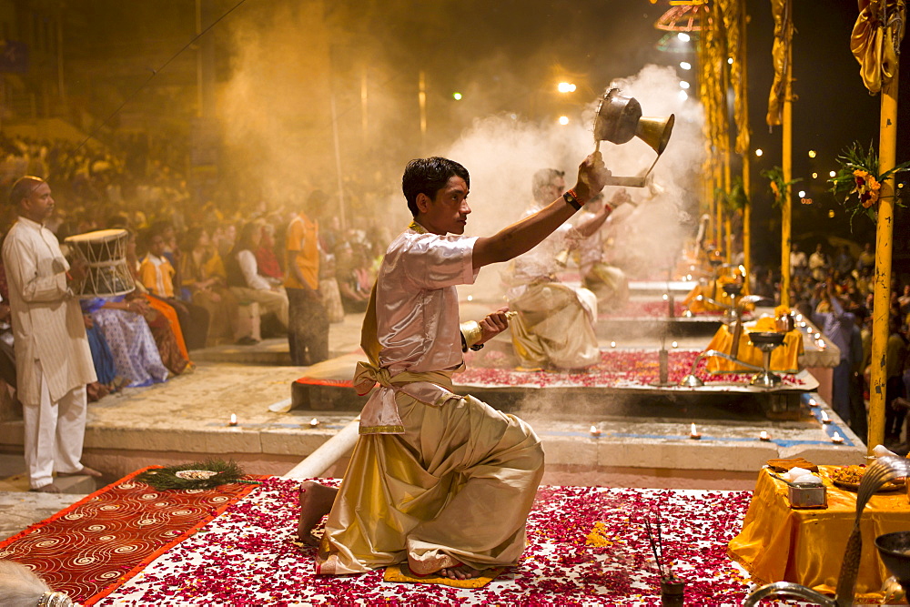 Hindu priests at sundown Aarti Ritual Ceremony of Light during Shivrati Festival in Holy City of Varanasi, Benares, India