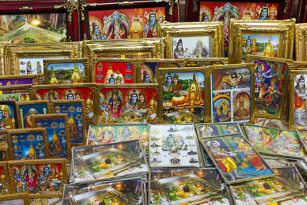 Religious pictures of Lord Shiva and wife Parwati on sale at stall by the Golden Temple in holy city of Varanasi, Benares, Northern India