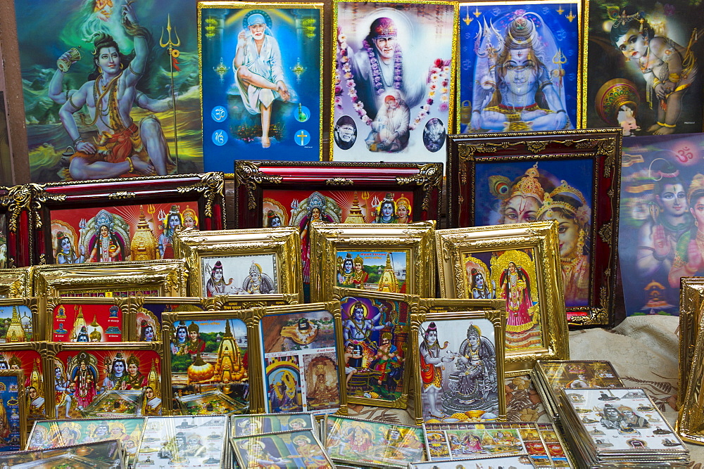 Religious pictures of Lord Shiva and wife Parwati on sale at stall by the Golden Temple in holy city of Varanasi, Benares, Northern India