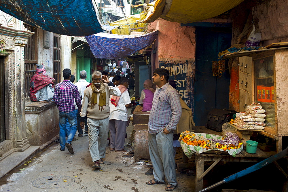 Indian people in alleyway in the holy city of Varanasi, Benares, Northern India