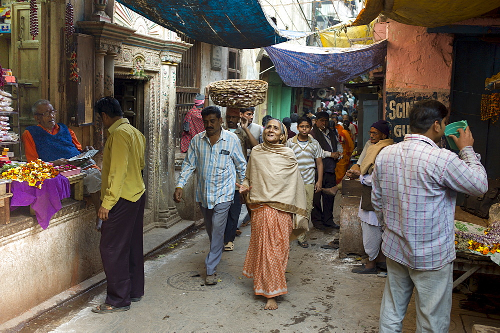 Indian people in alleyway in the holy city of Varanasi, Benares, Northern India