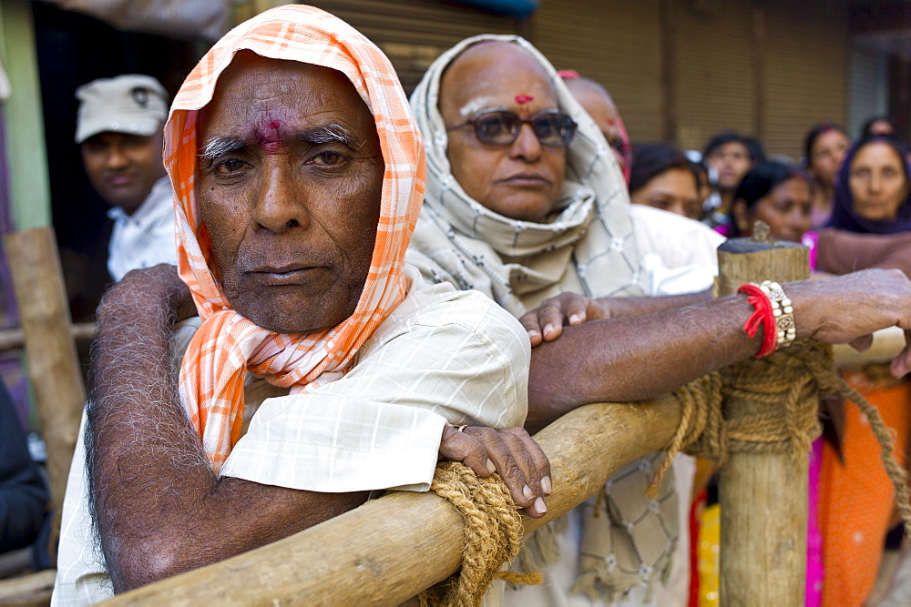 Indian Hindu pilgrims queue to visit the Golden Temple during Festival of Shivaratri in holy city of Varanasi, Northern India