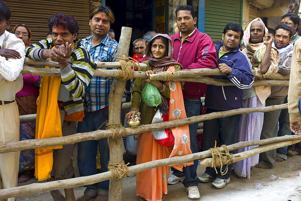 Indian Hindu pilgrims queue to visit the Golden Temple during Festival of Shivaratri in holy city of Varanasi, Northern India