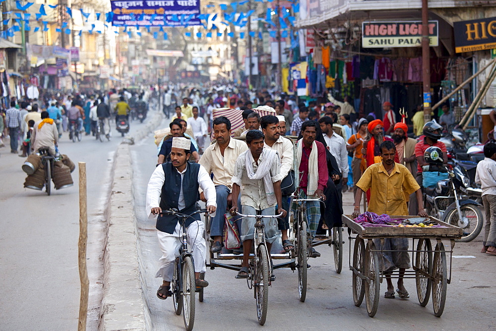 Muslim and Hindus in crowded street scene during holy Festival of Shivaratri in city of Varanasi, Benares, Northern India