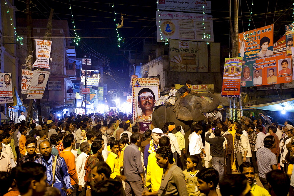 Ceremonial elephant moves through crowd at Festival of Shivaratri in the streets of the holy city of Varanasi, Benares, Northern India