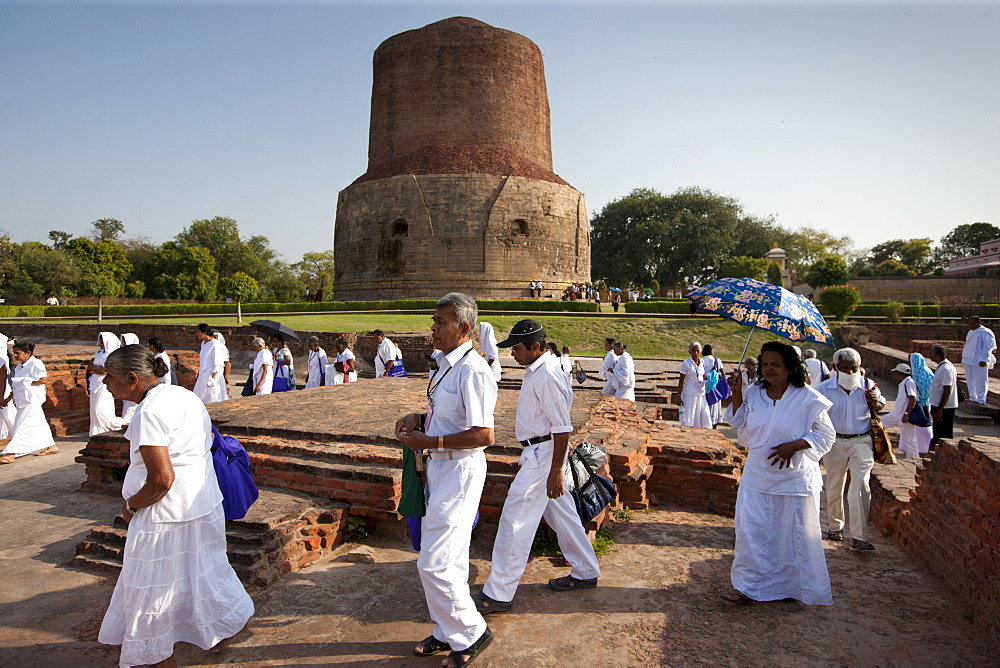 Sri Lankan Buddhist visitors at Dhamakh Stupa at Sarnath ruins near Varanasi, Benares, Northern India