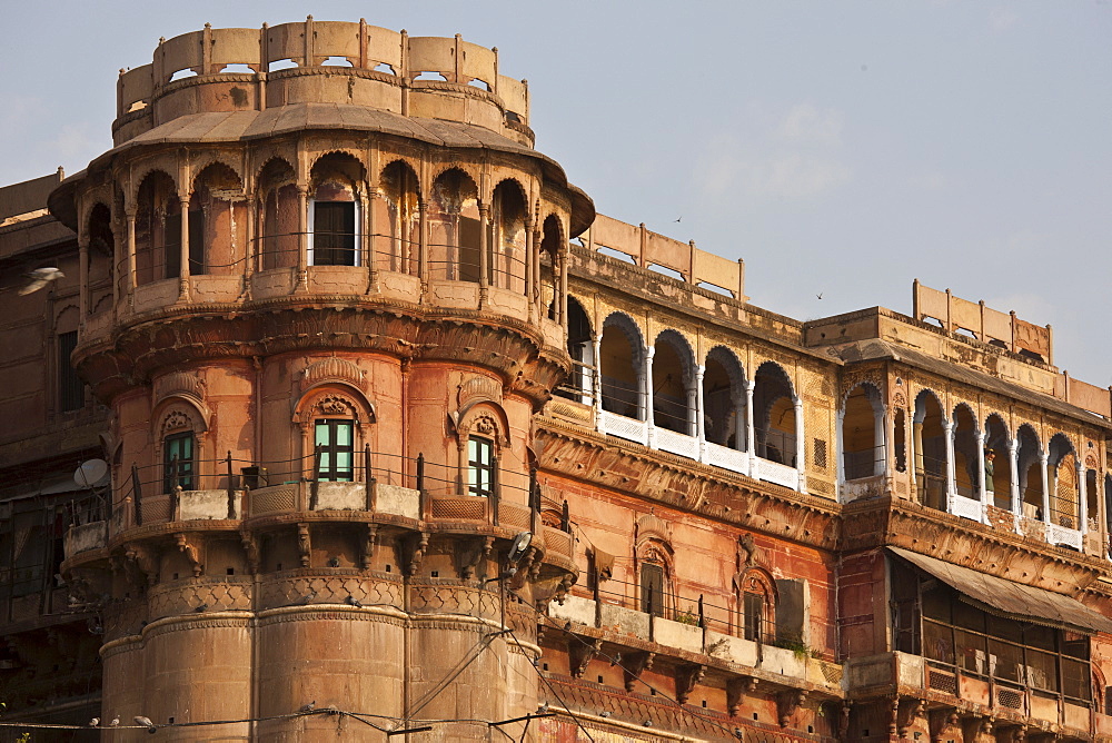 Traditional architecture ancient building fronting the famous Ghats by The Ganges River in Holy City of Varanasi, India