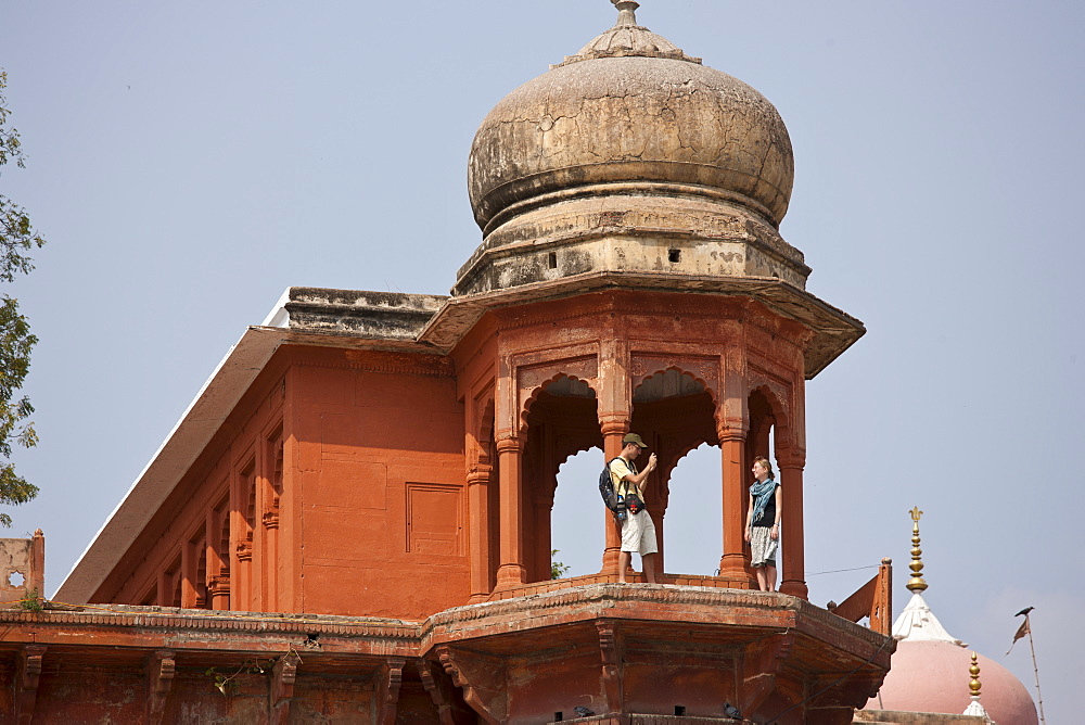 Tourists at Maharaja Chet Singh Palace Fort at Chet Singh Ghat  by The Ganges River in holy city of Varanasi, Northern India