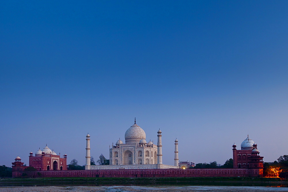 The Taj Mahal North Side and Mosque viewed across Yamuna River at sunset , India