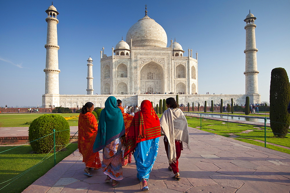 Indian tourists visiting The Taj Mahal mausoleum approach the southern view, Uttar Pradesh, India