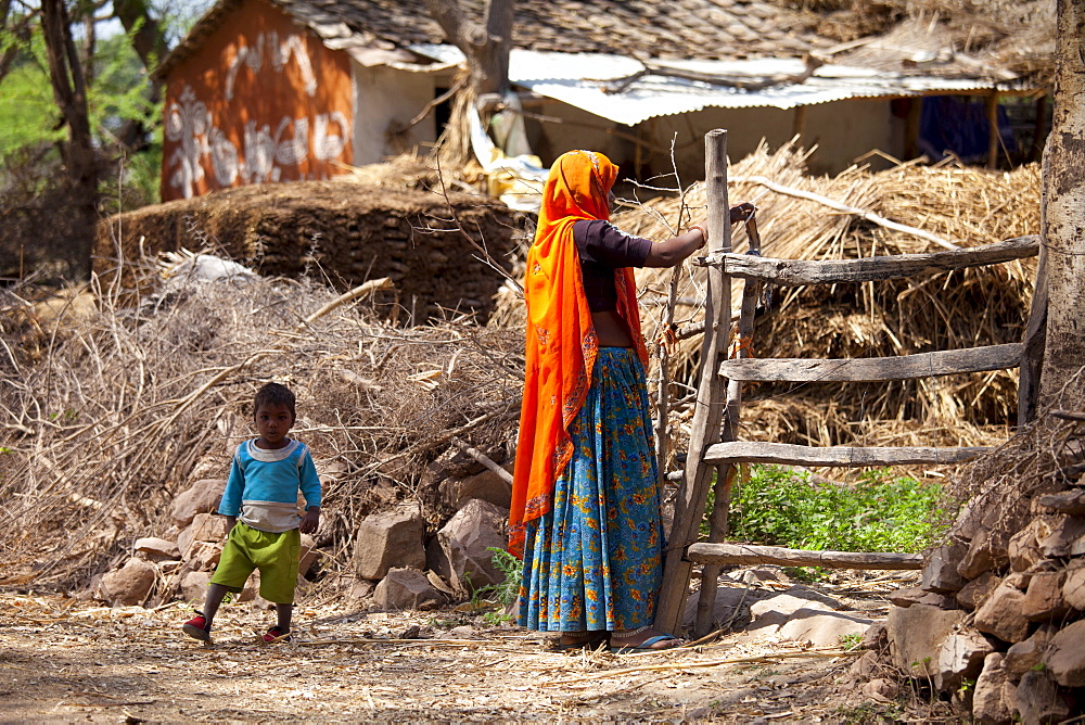 Indian woman villager and child at her smallholding farm at Kutalpura Village in Rajasthan, Northern India