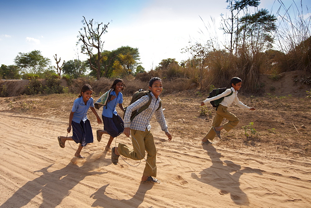 Indian schoolboys and girls walking to school at Doeli in Sawai Madhopur, Rajasthan, Northern India