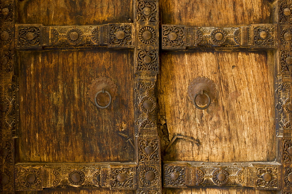 Hindu style traditional door in Acacia wood at the 16th Century Amber Fort in Jaipur in Rajasthan, Northern India