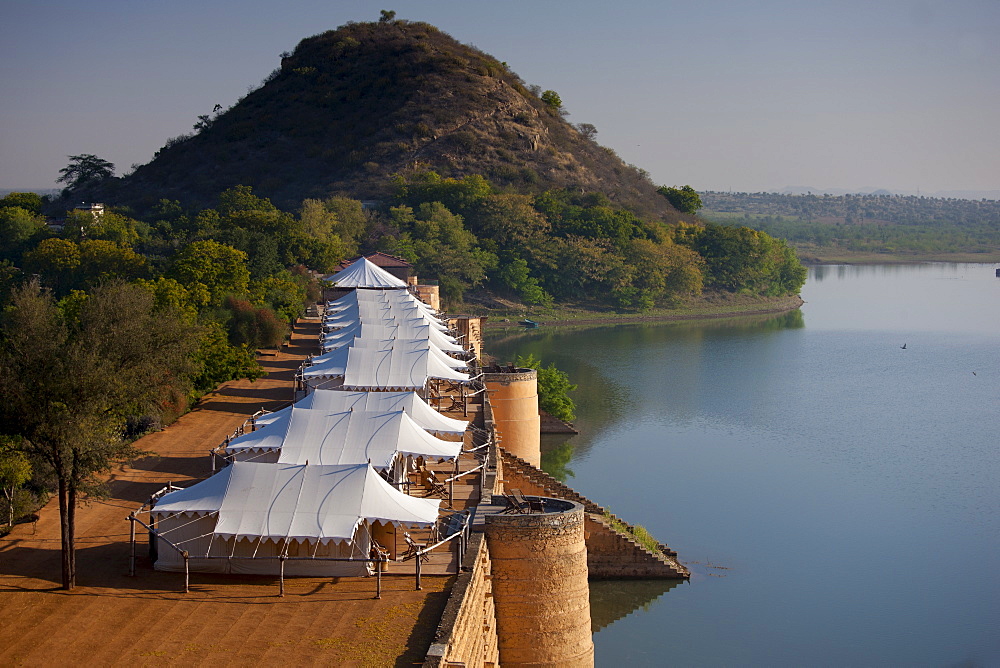 Chhatra Sagar reservoir and luxury tented camp oasis in the desert at Nimaj, Rajasthan, Northern India