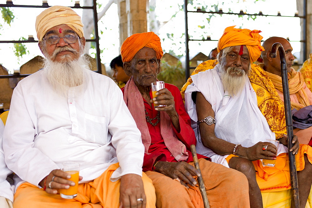 Hindu priests at Holi festival of 76th Maharana of Mewar, Shriji Arvind Singh Mewar of Udaipur, at the City Palace, Rajasthan, India