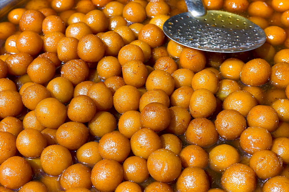 Deep-fried snack foods on sale in old town market Udaipur, Rajasthan, Western India,