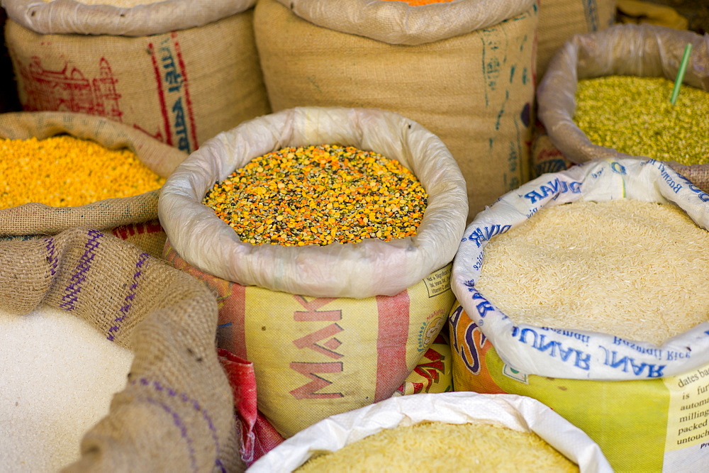 Spices and pulses including lentils and rice on sale in old town market Udaipur, Rajasthan, Western India,