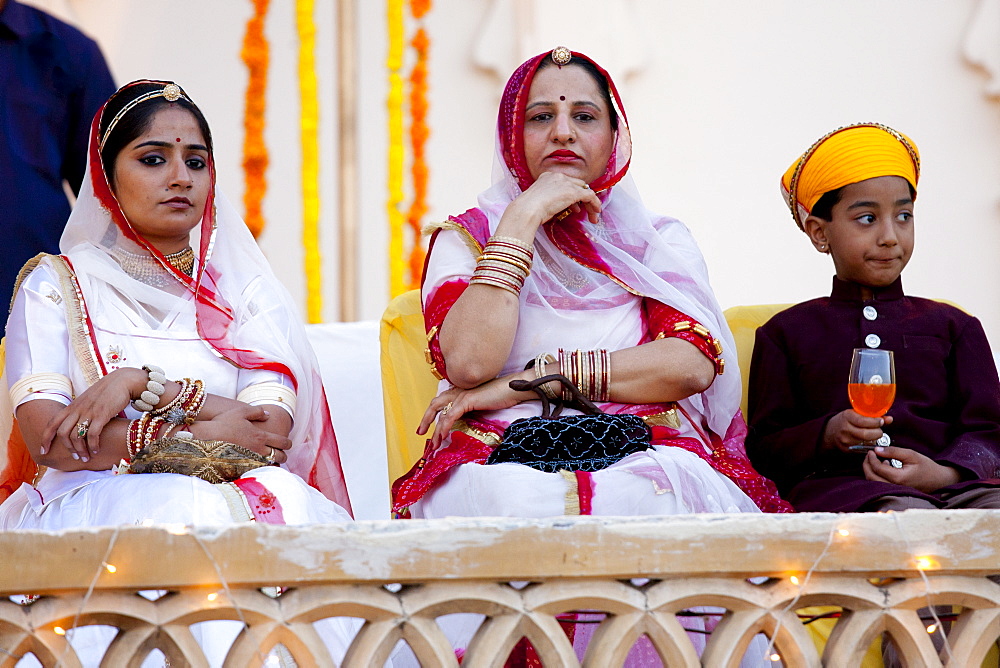 Royal Family guests from the feudal family of Karjali at Holi festival of 76th Maharana of Mewar, His Highness, Shriji Arvind Singh Mewar of Udaipur, at the City Palace, Rajasthan, India
(left to right: Sidhi Kumari, Karuna Kunwar, Bahv Vaibhav Singh)