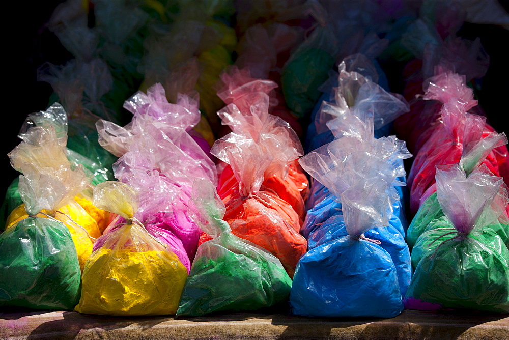 Bags of powder colours on sale for traditional Hindu Holi festival in old town Udaipur, Rajasthan, Western India