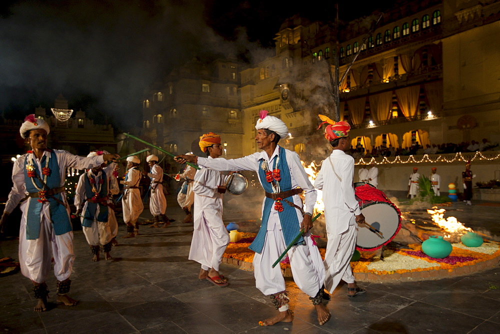 Traditional Ger dancers at The Maharana's City Palace for annual Hindu Holi Fire Festival by The Zenana Mahal, Udaipur, Rajasthan, India.